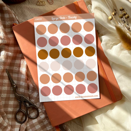 Large circles in cosy warm colours like peach, pink and brown.