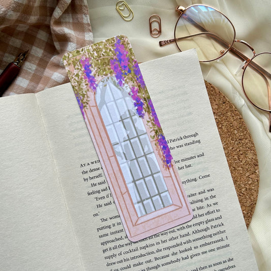 Regency themed bookmark featuring a long ornate window surrounded by purple wisteria and a silhouette of a woman holding a letter